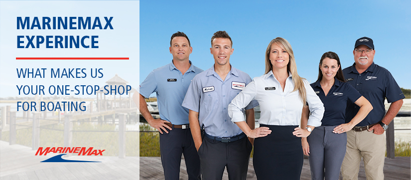 Five MarineMax team members posing and smiling