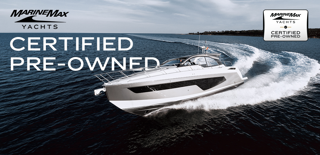 an azimut a51 carving up the water with marinemax yachts certified pre owned badge