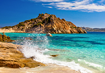 water hitting rocks along coast of sardinia
