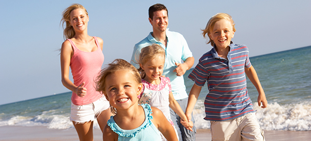 Family walking on beach